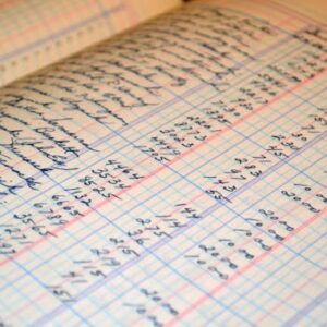 Close-up of a vintage handwritten ledger detailing financial records and accounts.
