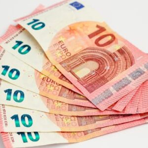 Close-up of a fan of 10 euro banknotes on a clean white background, showcasing European currency.